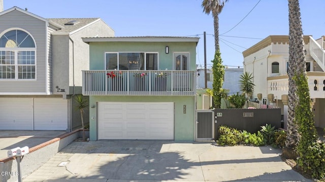 256 Melrose Dr, Oxnard, CA 93035 - view of front of property with stucco siding, concrete driveway, and an attached garage