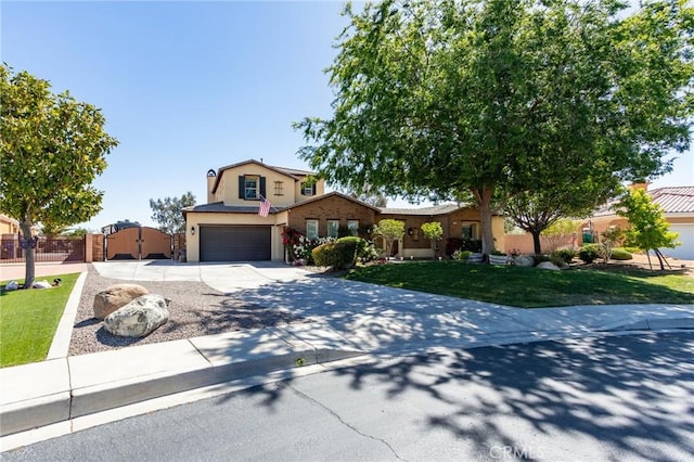13195 Trailwood Way, Apple Valley, CA 92308 - view of front of property with a garage, concrete driveway, stucco siding, and a gate