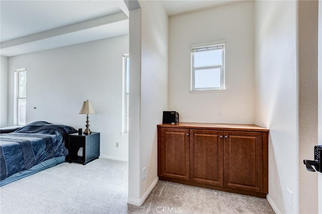 13195 Trailwood Way, Apple Valley, CA 92308 - bedroom featuring multiple windows, light carpet, and baseboards