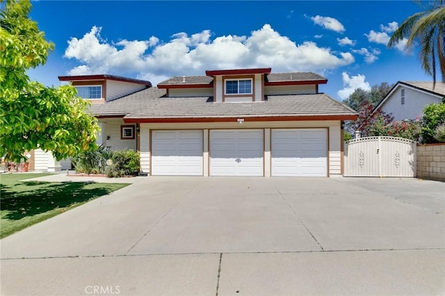 1158 Regal Canyon Dr, Walnut, CA 91789 - view of front facade with concrete driveway, a gate, a garage, and a front yard