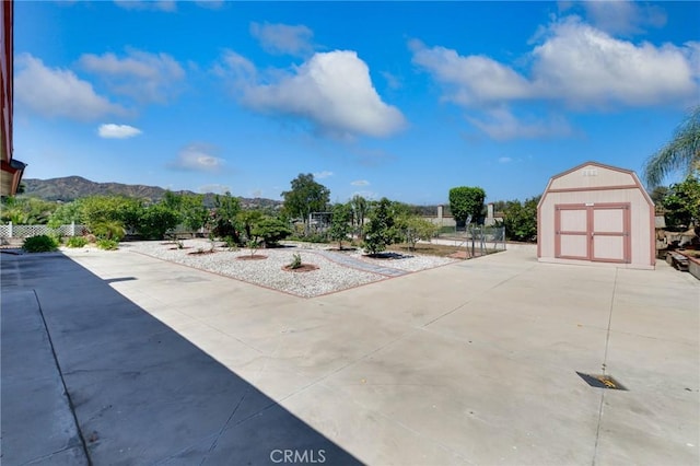 1158 Regal Canyon Dr, Walnut, CA 91789 - view of patio featuring a shed, an outbuilding, and a mountain view