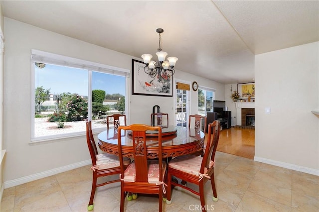 1158 Regal Canyon Dr, Walnut, CA 91789 - dining room featuring a chandelier, a fireplace, and baseboards