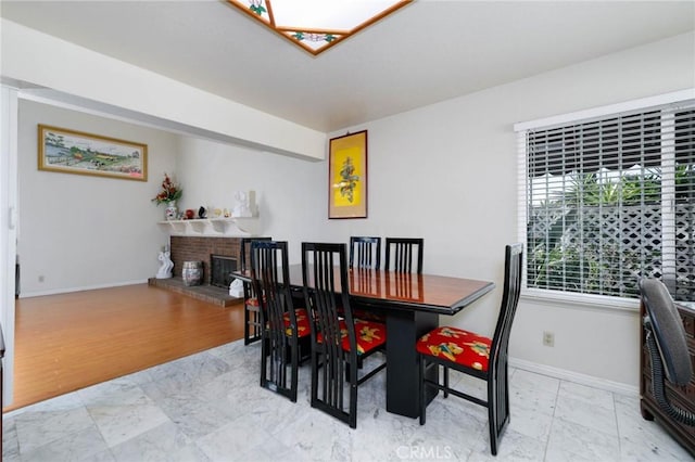 1158 Regal Canyon Dr, Walnut, CA 91789 - dining area with baseboards and a fireplace