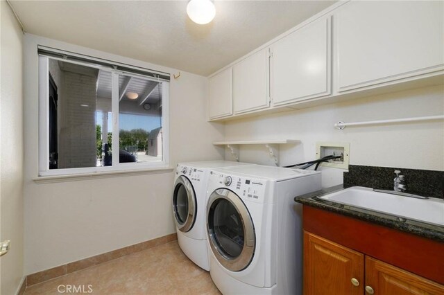 1158 Regal Canyon Dr, Walnut, CA 91789 - clothes washing area featuring washing machine and clothes dryer, cabinet space, and baseboards