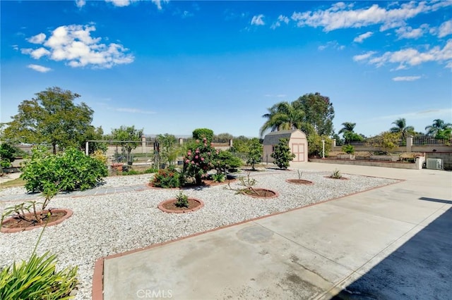 1158 Regal Canyon Dr, Walnut, CA 91789 - view of yard featuring a storage shed, an outdoor structure, central AC, and fence