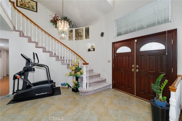 1158 Regal Canyon Dr, Walnut, CA 91789 - entryway with high vaulted ceiling, stairs, and a chandelier