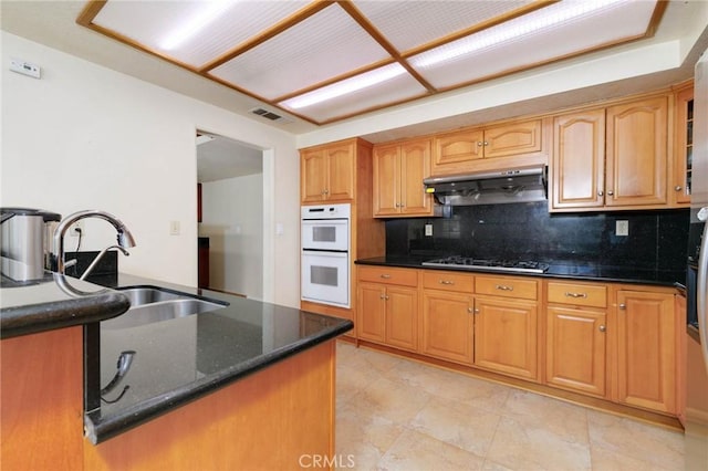 1158 Regal Canyon Dr, Walnut, CA 91789 - kitchen featuring under cabinet range hood, a sink, double oven, black cooktop, and decorative backsplash