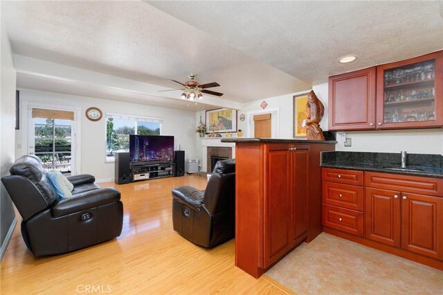 1158 Regal Canyon Dr, Walnut, CA 91789 - living room featuring light wood-style floors, a fireplace, a ceiling fan, recessed lighting, and a textured ceiling