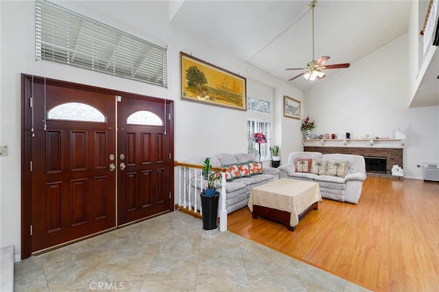 1158 Regal Canyon Dr, Walnut, CA 91789 - foyer entrance featuring ceiling fan, high vaulted ceiling, and a fireplace