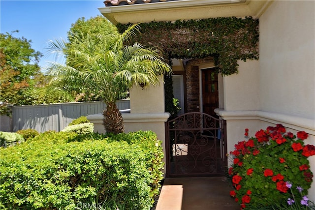 29424 Springside Dr, Menifee, CA 92584 - view of exterior entry with a gate and stucco siding