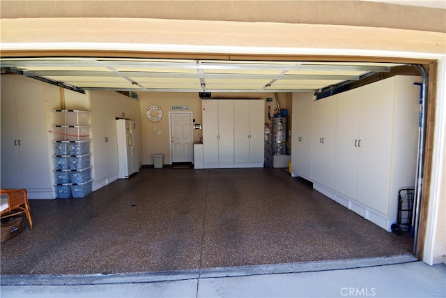 29424 Springside Dr, Menifee, CA 92584 - garage with white refrigerator with ice dispenser