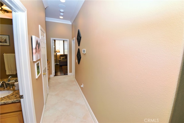 29424 Springside Dr, Menifee, CA 92584 - hall featuring crown molding, light tile patterned floors, a sink, and baseboards