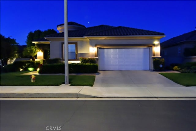 29424 Springside Dr, Menifee, CA 92584 - prairie-style house with driveway, an attached garage, stucco siding, a yard, and a tile roof