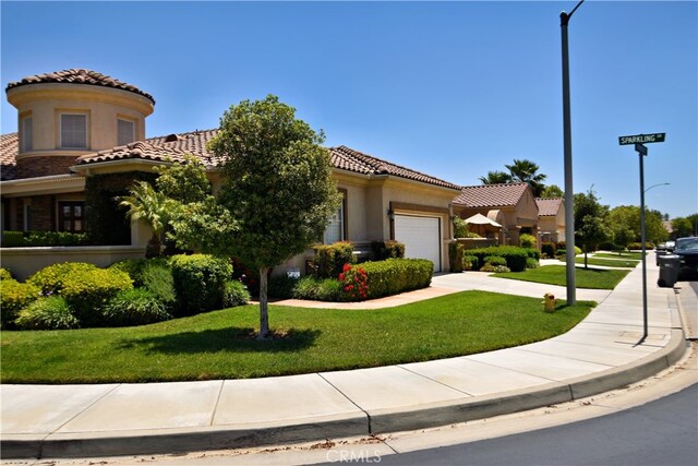 29424 Springside Dr, Menifee, CA 92584 - mediterranean / spanish-style home featuring an attached garage, a tile roof, and a front lawn