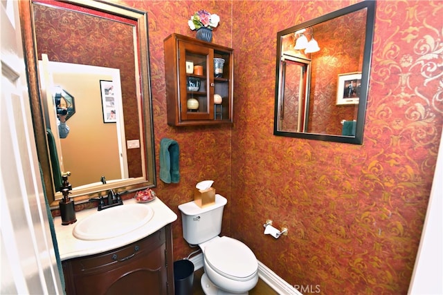 29424 Springside Dr, Menifee, CA 92584 - bathroom with toilet, vanity, and wallpapered walls