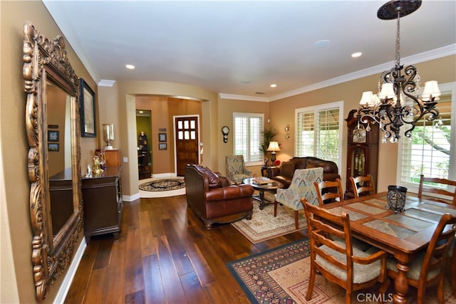 29424 Springside Dr, Menifee, CA 92584 - dining room featuring dark wood-style flooring, crown molding, arched walkways, a chandelier, and recessed lighting