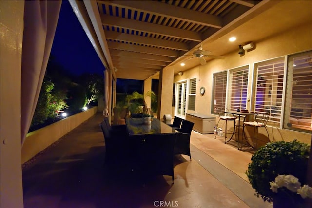 29424 Springside Dr, Menifee, CA 92584 - patio at night featuring outdoor dining space, a ceiling fan, and a patio