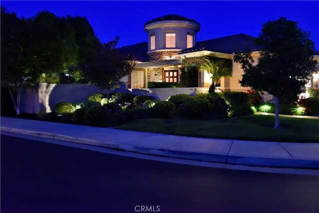 29424 Springside Dr, Menifee, CA 92584 - view of front of house featuring stucco siding, a tiled roof, and a lawn