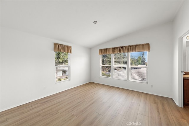 2851 Rolling Hills Dr Unit 224, Fullerton, CA 92835 - empty room featuring vaulted ceiling, plenty of natural light, and light wood-style floors
