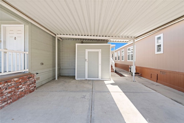 view of patio with a storage shed