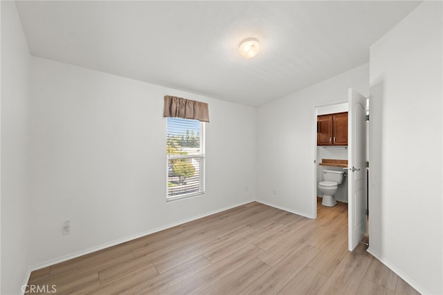 2851 Rolling Hills Dr Unit 224, Fullerton, CA 92835 - unfurnished bedroom with light wood-type flooring and baseboards