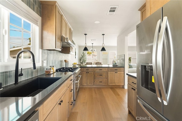 20010 Ingrum Way, Torrance, CA 90503 - kitchen with appliances with stainless steel finishes, a sink, dark countertops, light wood-style flooring, and recessed lighting