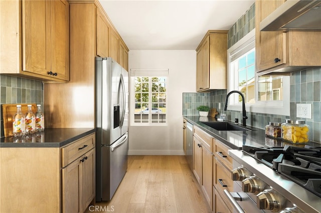 20010 Ingrum Way, Torrance, CA 90503 - kitchen featuring stainless steel appliances, a sink, under cabinet range hood, light wood-style floors, and baseboards