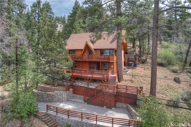 43214 Sunset Dr, Big Bear Lake, CA 92315 - back of house with stairway, a wooden deck, a shingled roof, and a patio