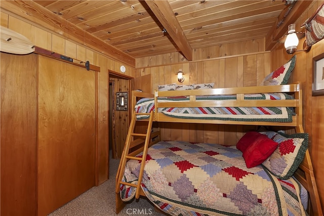 43214 Sunset Dr, Big Bear Lake, CA 92315 - bedroom featuring carpet floors, wooden walls, and wooden ceiling with exposed beams