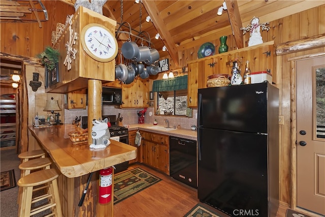 43214 Sunset Dr, Big Bear Lake, CA 92315 - kitchen featuring black appliances, backsplash, wooden ceiling, light wood-style floors, and light countertops
