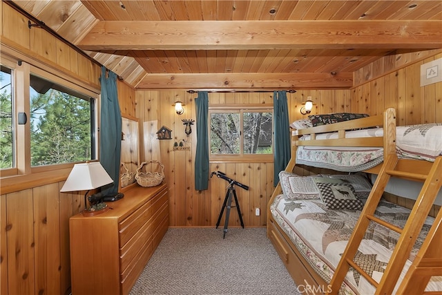 43214 Sunset Dr, Big Bear Lake, CA 92315 - carpeted bedroom featuring wooden ceiling with exposed beams, multiple windows, and wood walls