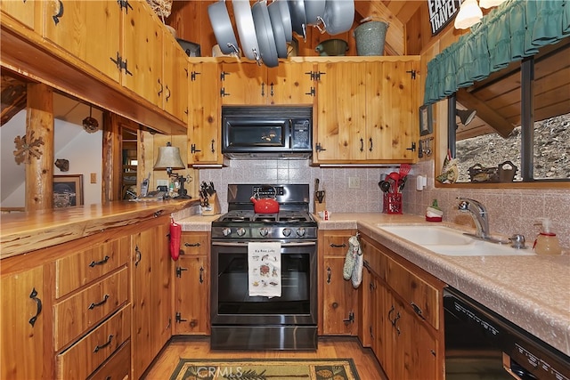 43214 Sunset Dr, Big Bear Lake, CA 92315 - kitchen featuring black appliances, a sink, light countertops, and tasteful backsplash