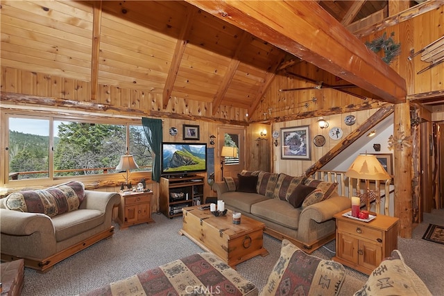 43214 Sunset Dr, Big Bear Lake, CA 92315 - living area with carpet floors, wooden walls, wood ceiling with exposed beams, and high vaulted ceiling