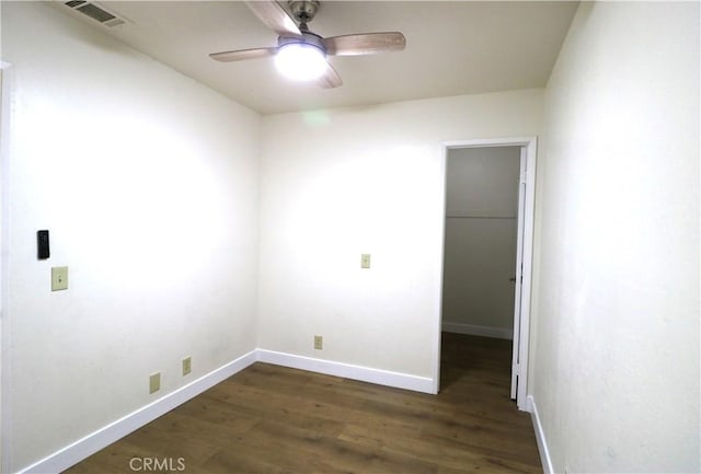 11010 Davis St, Moreno Valley, CA 92557 - spare room featuring dark wood-style flooring, ceiling fan, and baseboards