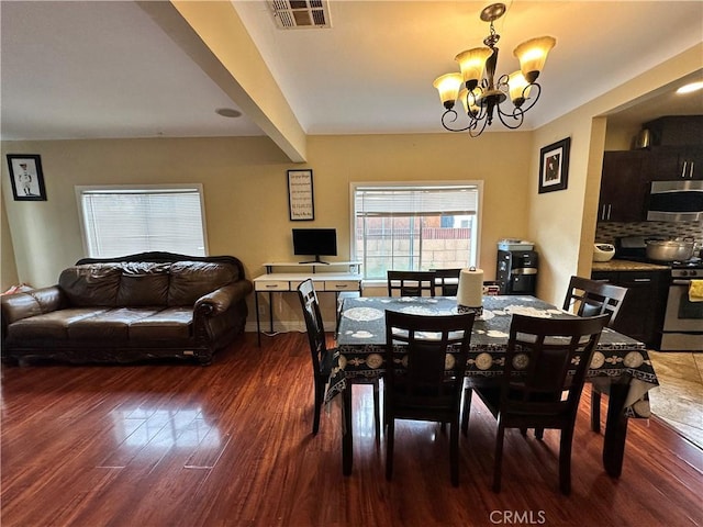 6127 Adenmoor Ave, Lakewood, CA 90713 - dining room with a chandelier and wood finished floors