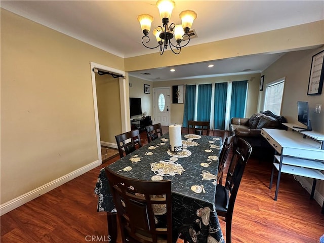 6127 Adenmoor Ave, Lakewood, CA 90713 - dining area with a chandelier, baseboards, and wood finished floors