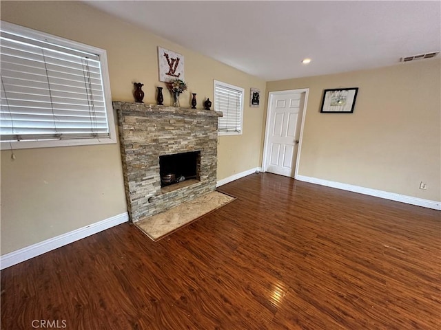6127 Adenmoor Ave, Lakewood, CA 90713 - unfurnished living room featuring wood finished floors, a fireplace, baseboards, and recessed lighting