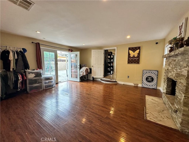 6127 Adenmoor Ave, Lakewood, CA 90713 - living room with wood finished floors, a stone fireplace, recessed lighting, and baseboards
