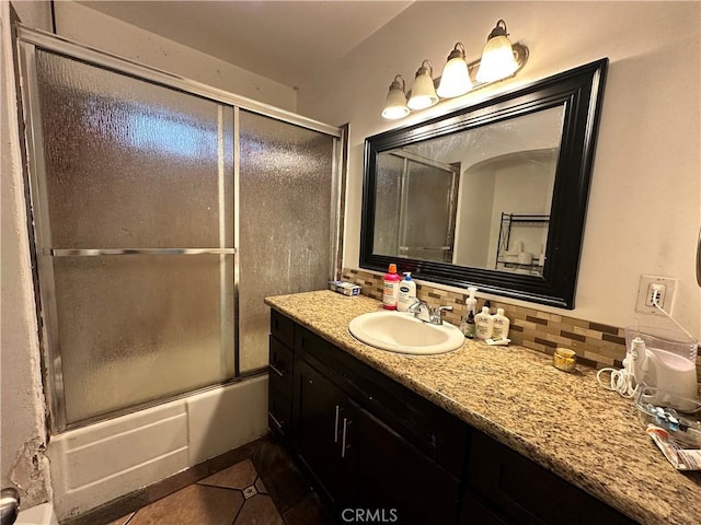 6127 Adenmoor Ave, Lakewood, CA 90713 - bathroom with backsplash, tile patterned floors, vanity, and shower / bath combination with glass door