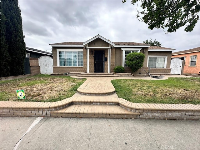 6127 Adenmoor Ave, Lakewood, CA 90713 - single story home featuring a storage unit, brick siding, and an outdoor structure
