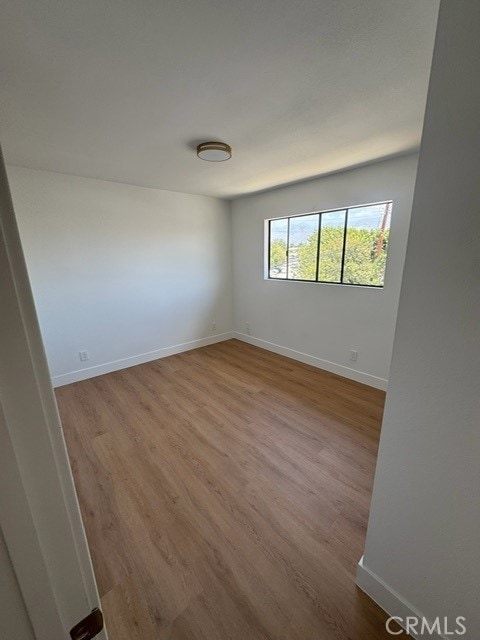 171 Junipero Serra Dr Unit D, San Gabriel, CA 91776 - spare room with wood finished floors and baseboards