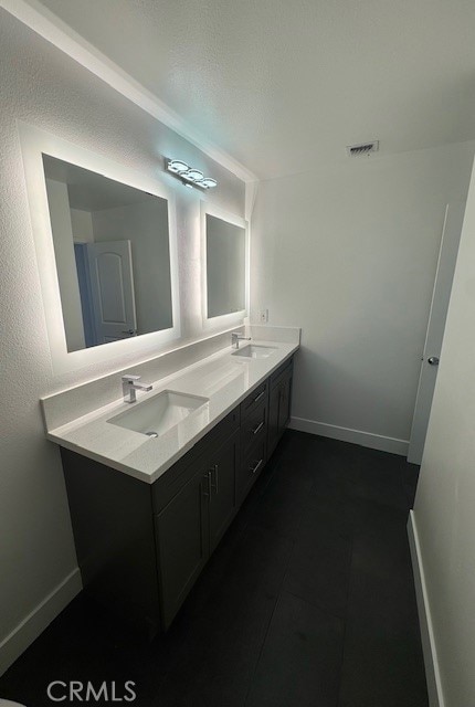 171 Junipero Serra Dr Unit D, San Gabriel, CA 91776 - bathroom featuring double vanity, baseboards, and tile patterned floors