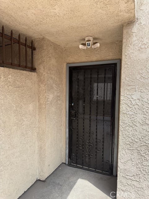 171 Junipero Serra Dr Unit D, San Gabriel, CA 91776 - view of exterior entry with stucco siding