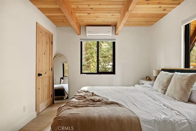 26664 Thunderbird Dr, Lake Arrowhead, CA 92391 - bedroom with a wall unit AC, wooden ceiling, beamed ceiling, light wood-style flooring, and baseboards