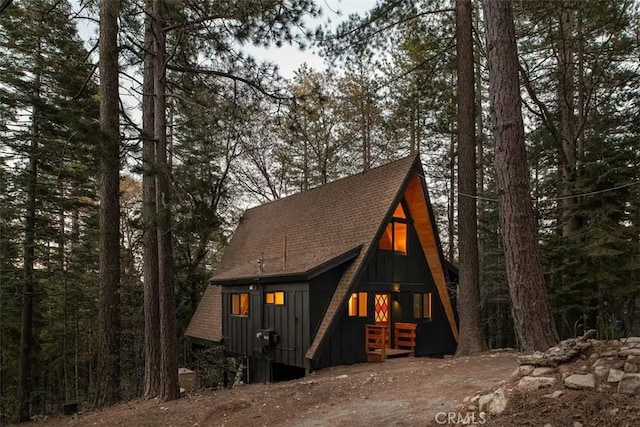 26664 Thunderbird Dr, Lake Arrowhead, CA 92391 - view of front of home with board and batten siding and roof with shingles