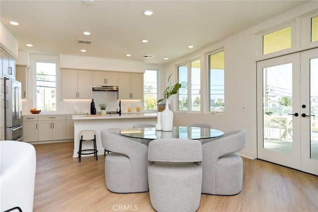 414 Main Unit 200, Huntington Beach, CA 92648 - dining room with light wood-style flooring, recessed lighting, and french doors