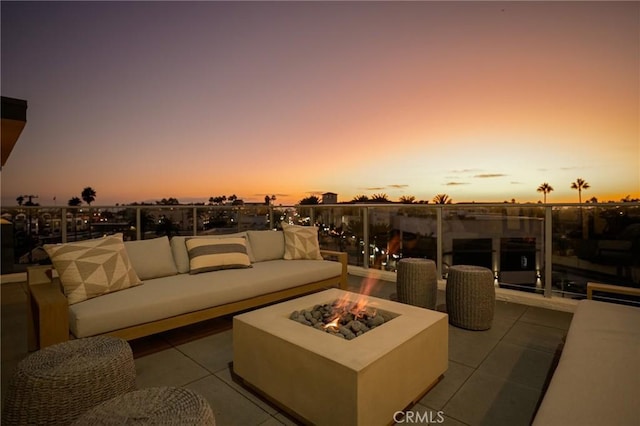 414 Main Unit 200, Huntington Beach, CA 92648 - patio terrace at dusk featuring an outdoor living space with a fire pit