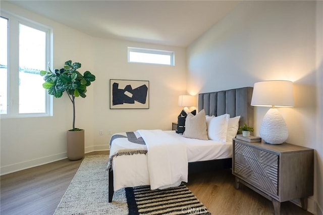 414 Main Unit 200, Huntington Beach, CA 92648 - bedroom with wood finished floors and baseboards