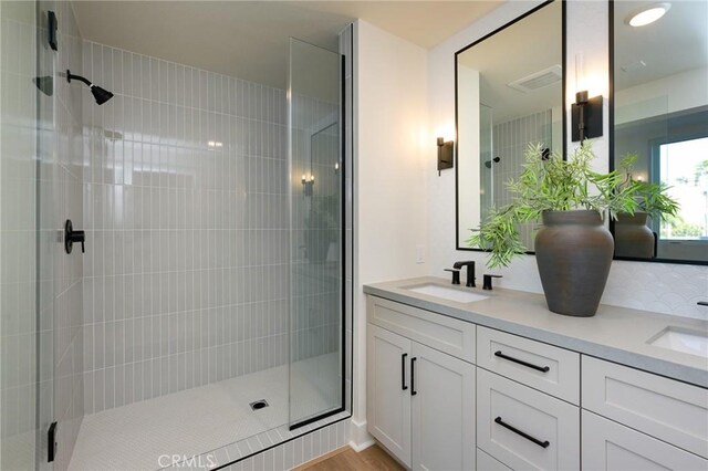 414 Main Unit 200, Huntington Beach, CA 92648 - bathroom featuring a shower stall and double vanity