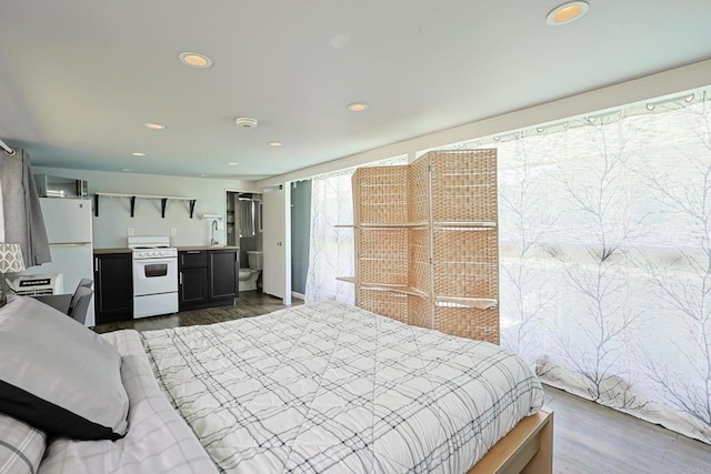 6683 Ballinger Ave, San Diego, CA 92119 - bedroom featuring freestanding refrigerator, dark wood-type flooring, and recessed lighting